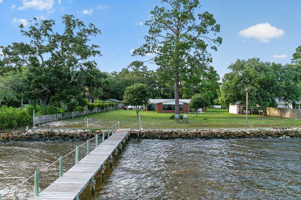 The dock seen from out on the water, looking back toward the lawn and home
